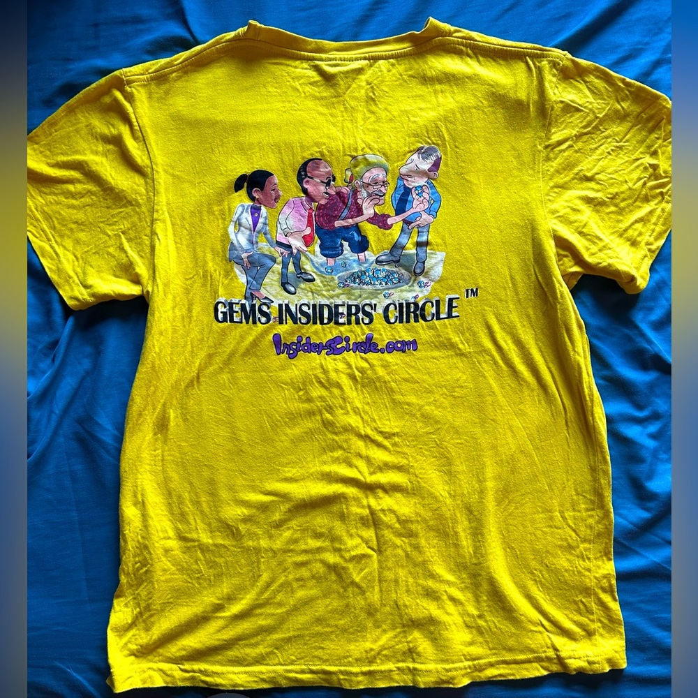 Gems wear yellow graphic tee